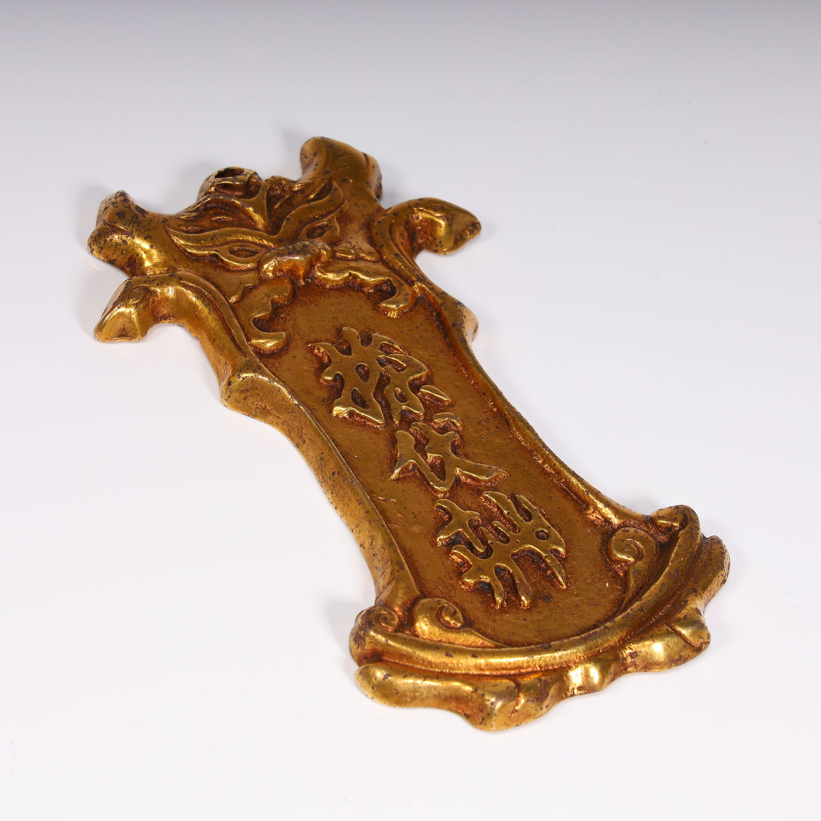 A copper-gilt token - 7