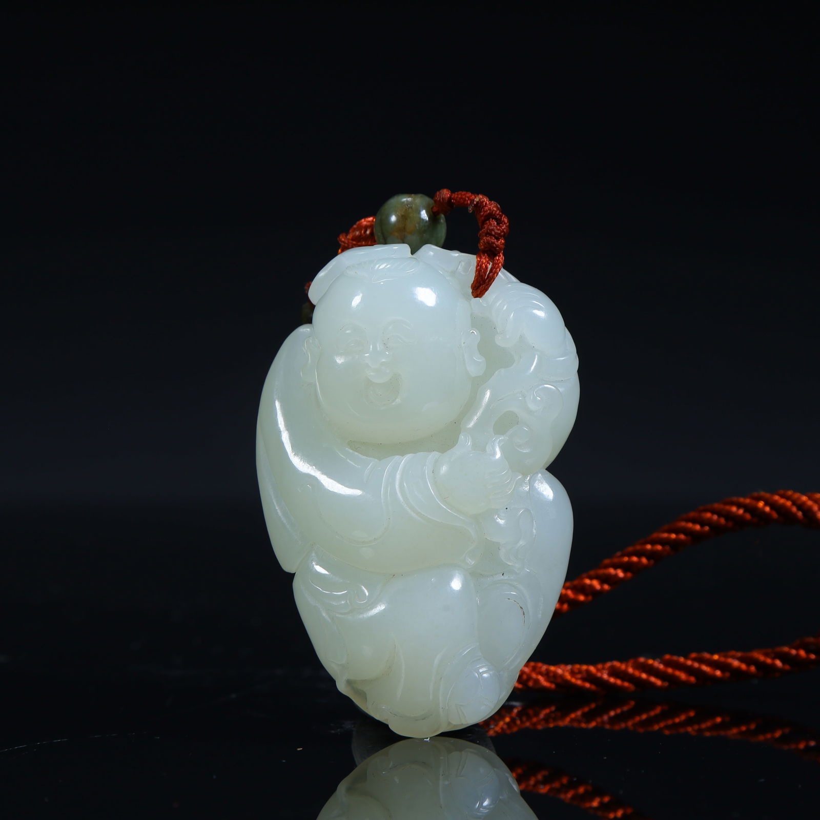 A Qing Dynasty Hetian jade boy holding a treasure pendant (1 of 9)