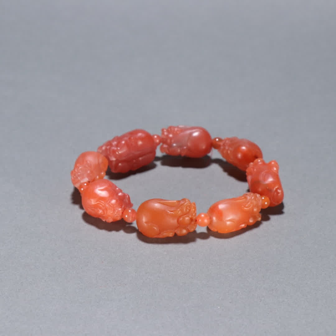 A Qing Dynasty Nanhong Pixiu bracelet: Qing Dynasty Nanhong Pixiu bracelet SIZE: W:1.5x2.6cm W:64.8g (The Dimensions Of All Batches Are Manually Measured.If You Need More Detailed Information, Please Contact Our Customer Service Before Bid