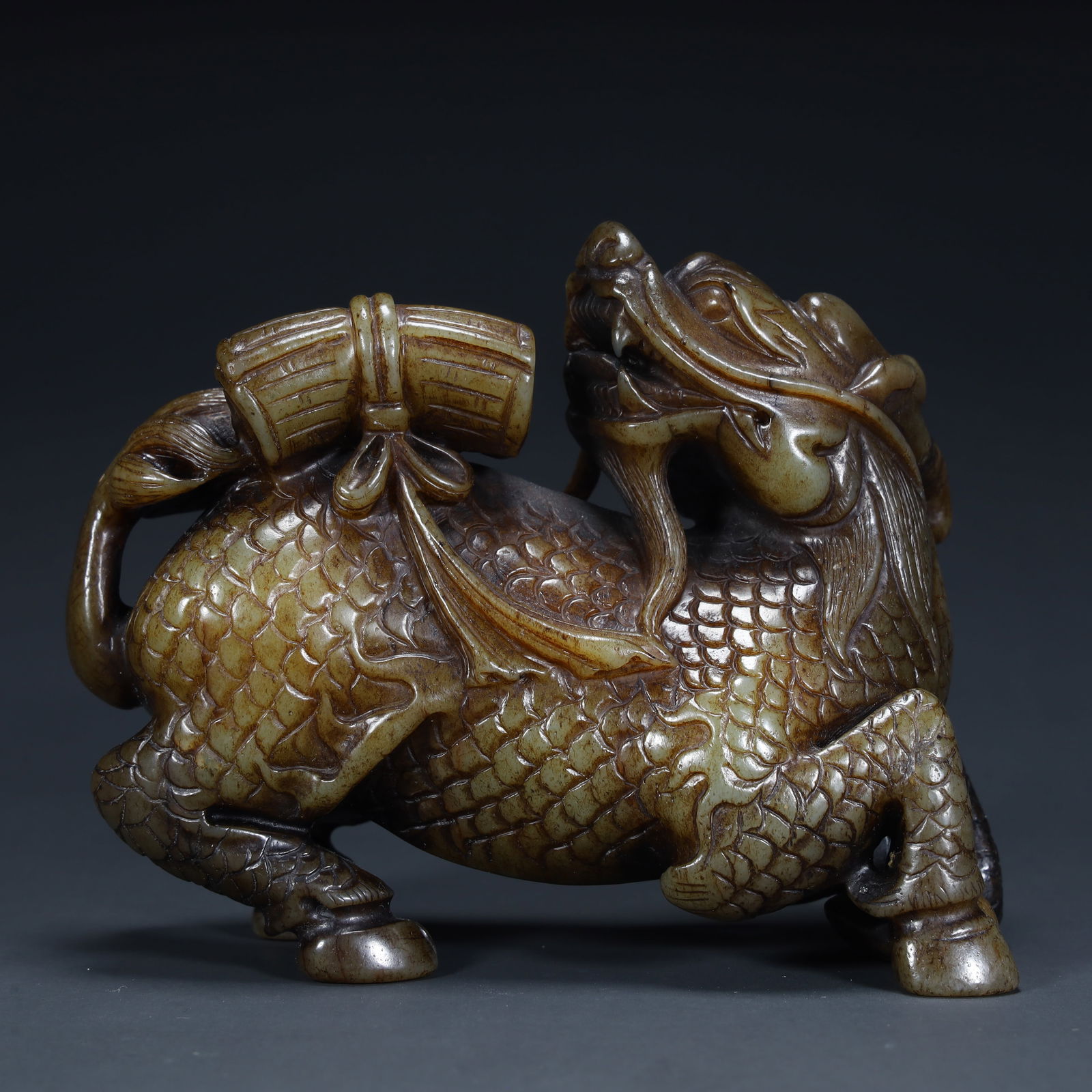 A Qing Dynasty Hetian jade "Qilin Sending Book" carving (1 of 11)