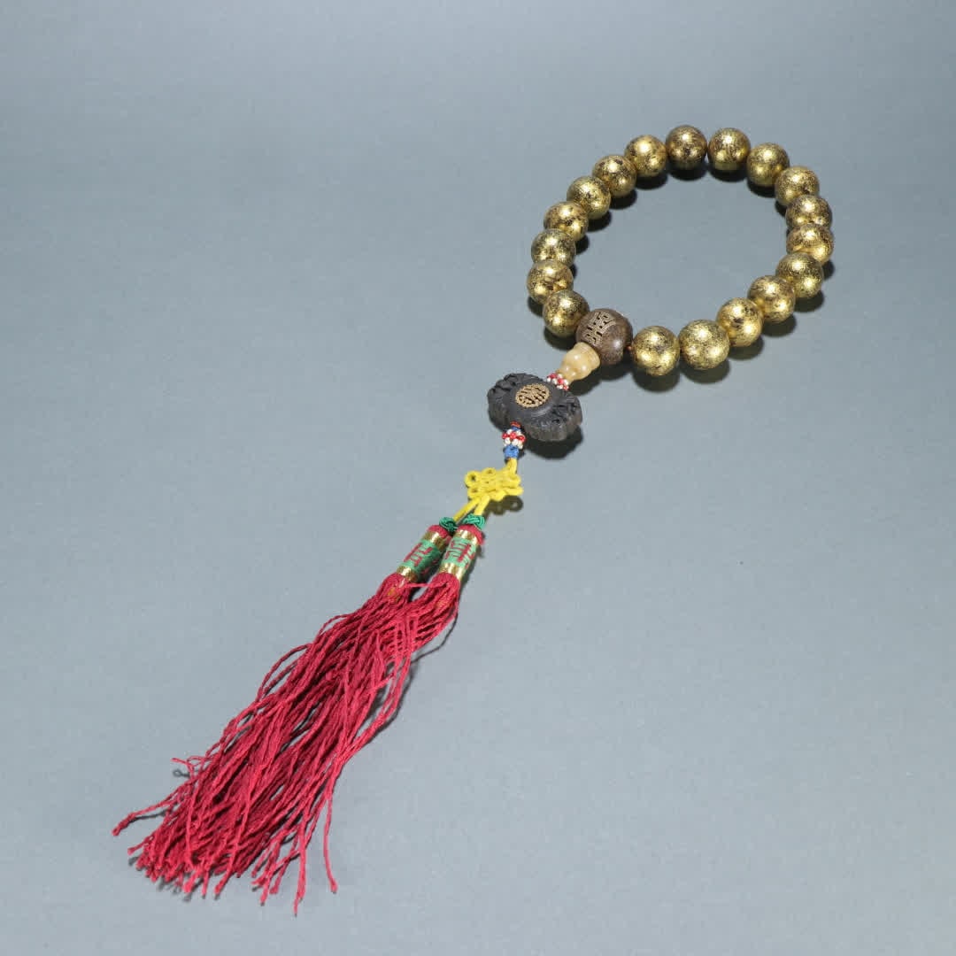 A piece of Qing Dynasty agarwood sealed gold eighteen sons held: Qing Dynasty Agarwood sealed gold eighteen sons held SIZE: Bead diameter 1.7cm W: 65.9g (The Dimensions Of All Batches Are Manually Measured.If You Need More Detailed Information, Please Contact Our C