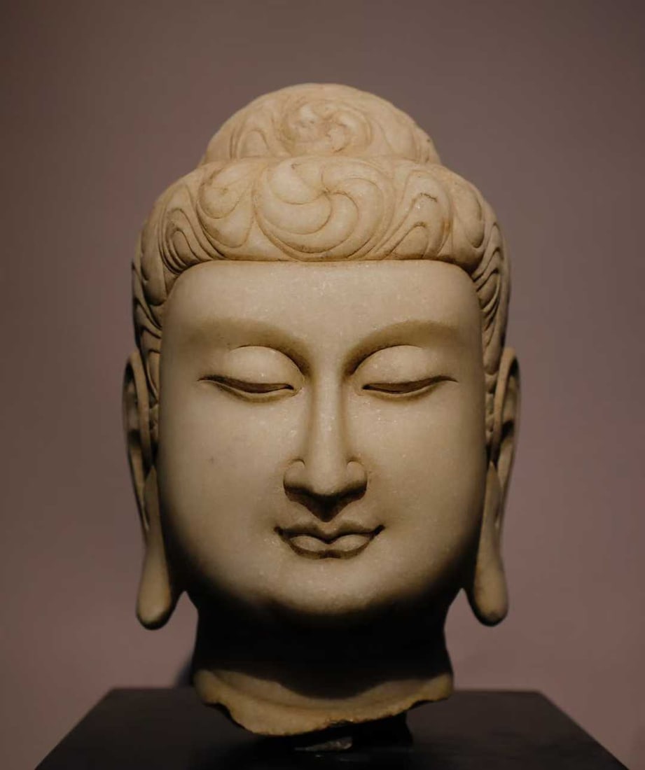 A white jade Buddha head of the Tang Dynasty (1 of 9)