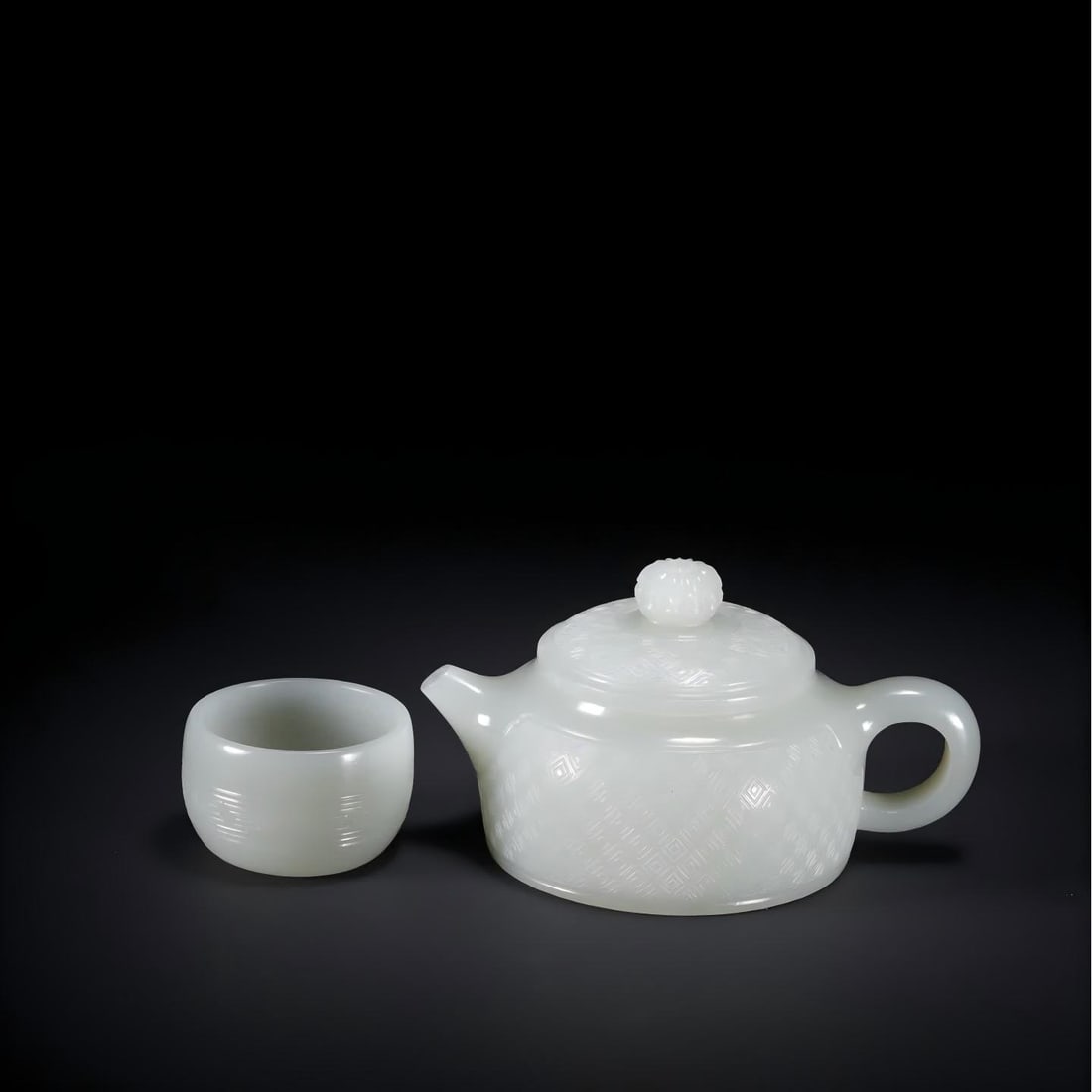 A Qing Dynasty Hetian jade pot with a cup (1 of 9)