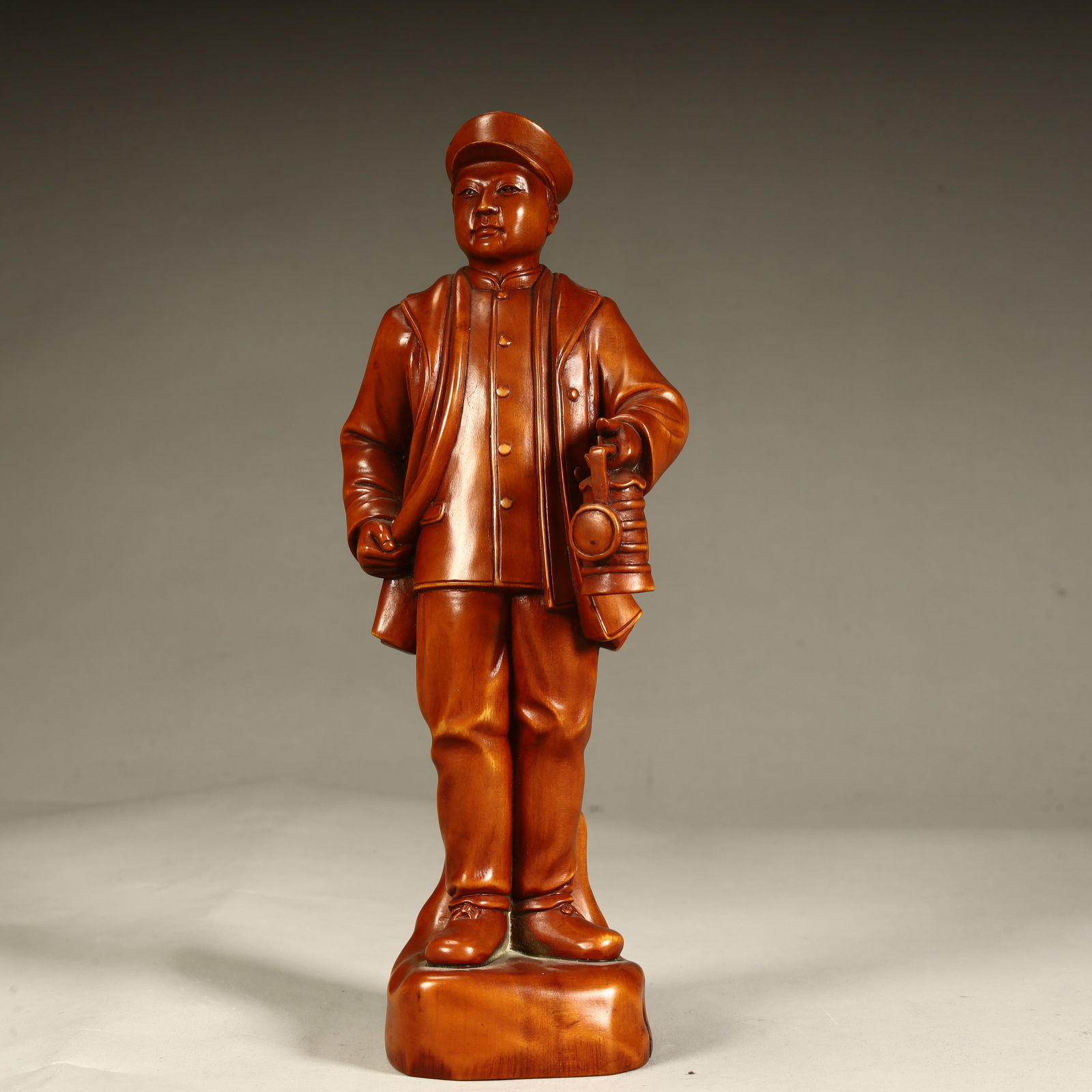 A statue of a boxwood carving worker (1 of 8)