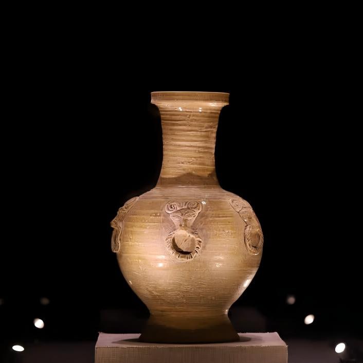 A Song Dynasty celadon paste shop head pattern pankou bottle (1 of 9)