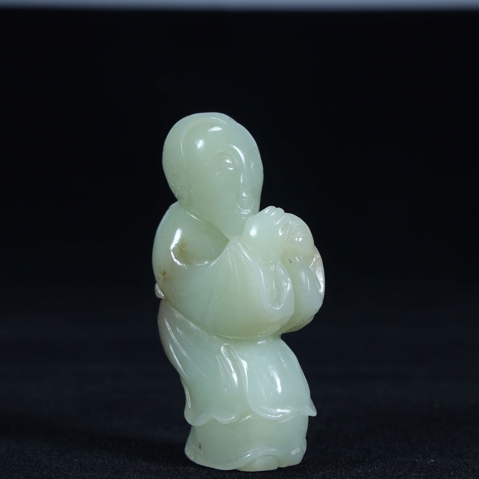 A piece of Qing Dynasty Hetian jade holding peach boy (1 of 9)