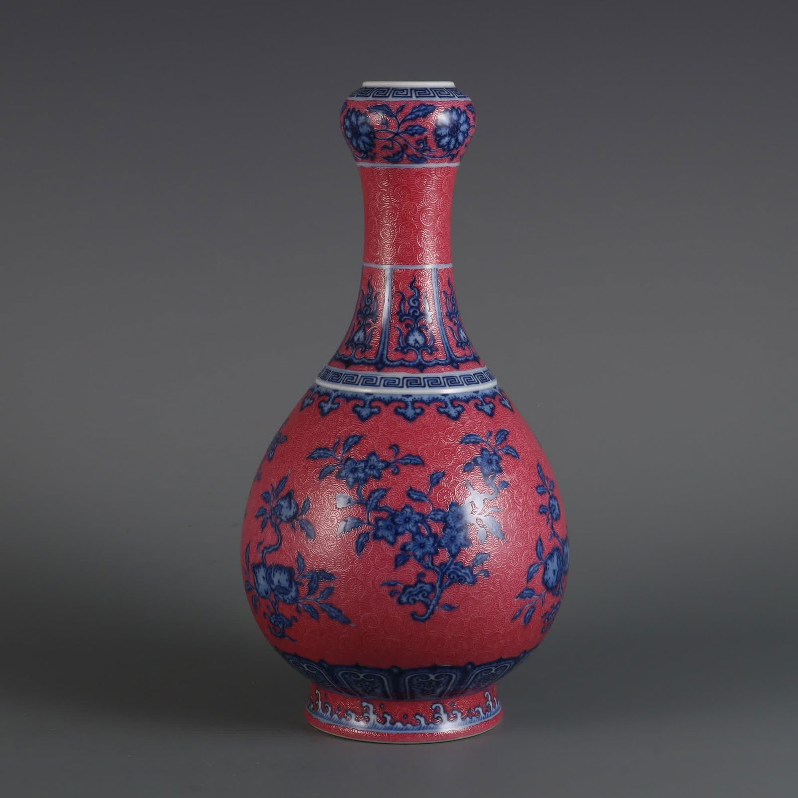 A garlic bottle made in the Qing Yongzheng year with blue and white and carmine ground flowers and (1 of 8)