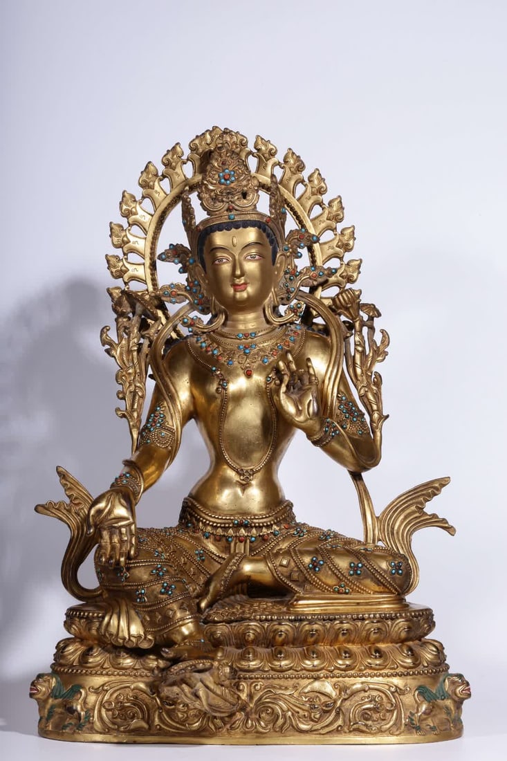A seated statue of Tara in a precious green inlaid with copper gilt in the Qing Dynasty: Qing Dynasty Dansati copper gilt inlaid gemstone green Tara seated statue SIZE: H:48cm L:33cm W:29cm W:11.25kg (The Dimensions Of All Batches Are Manually Measured.If You Need More Detailed Informatio
