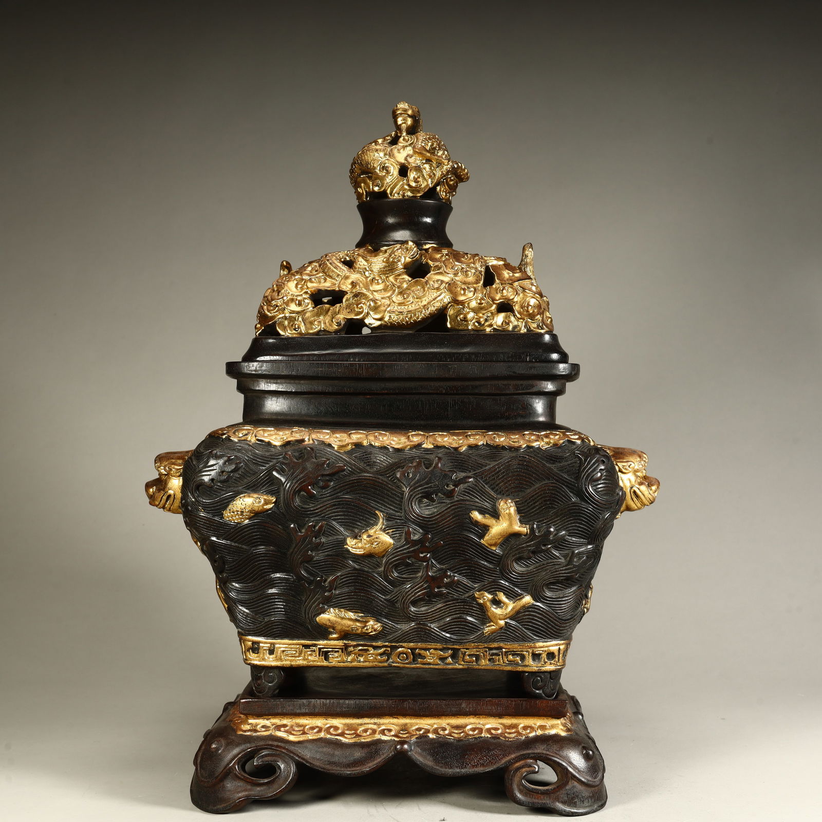 A Qing Dynasty rosewood gilt seawater beast pattern aroma burner (1 of 13)