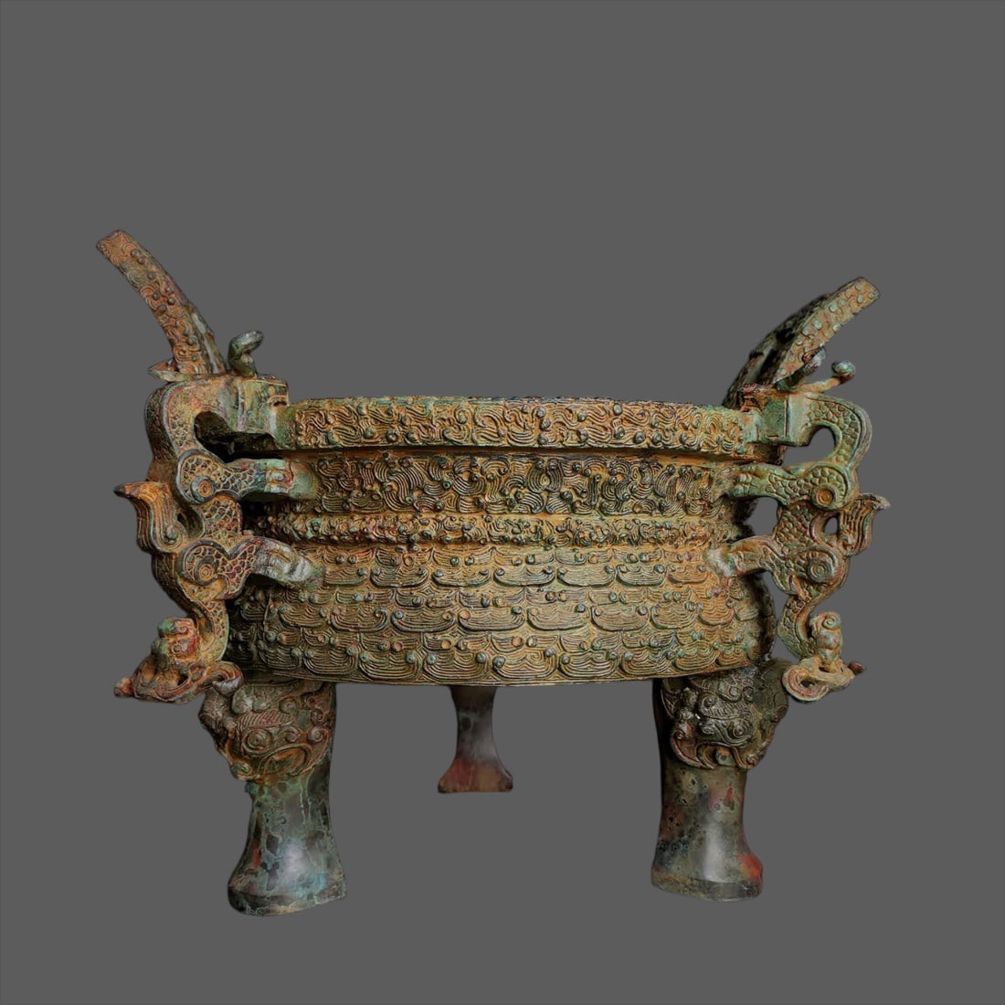 A Warring States bronze - four dragon round tripod (1 of 9)