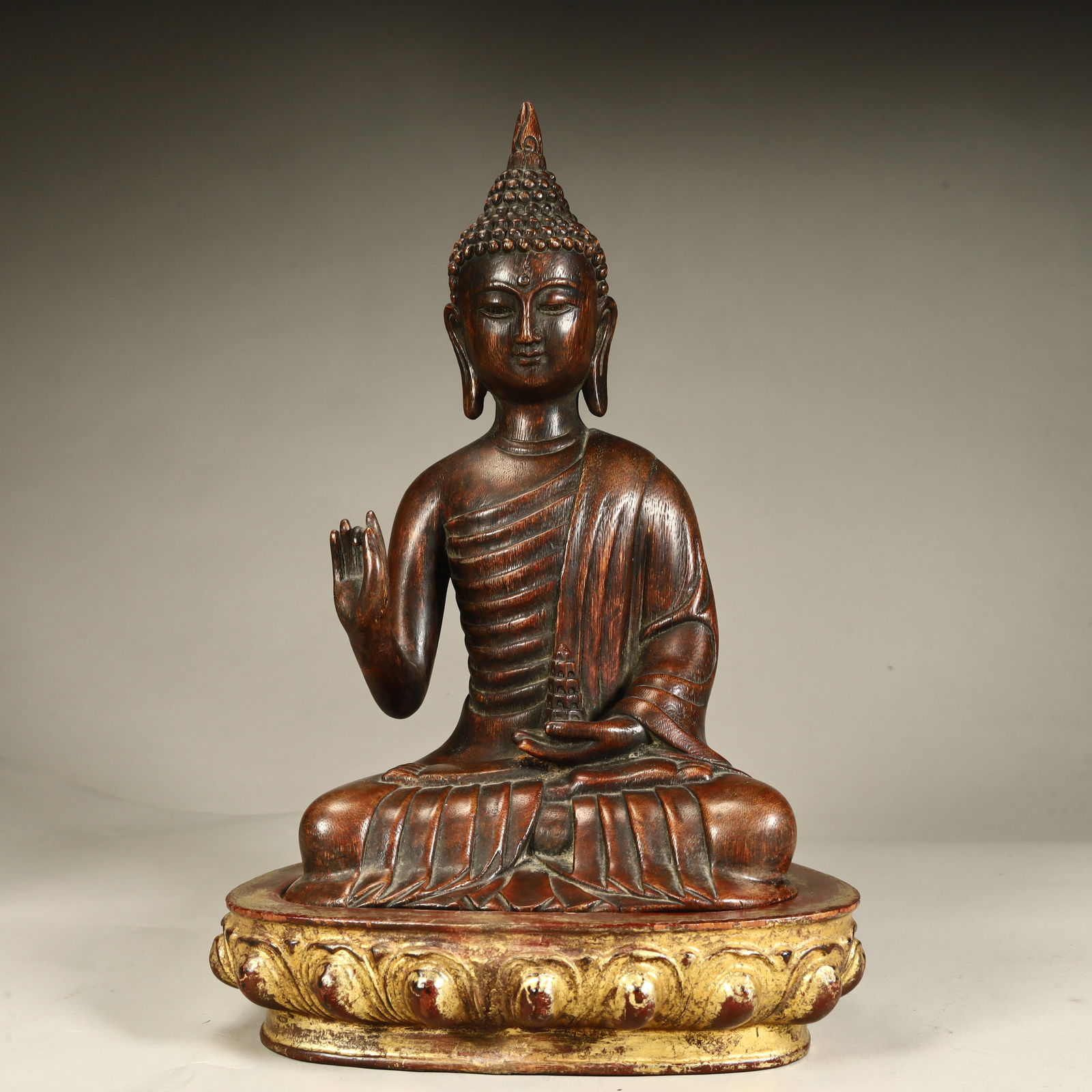 A seated statue of Shakyamuni Buddha carved in agarwood from the Qing Dynasty with a gilt lotus seat (1 of 11)