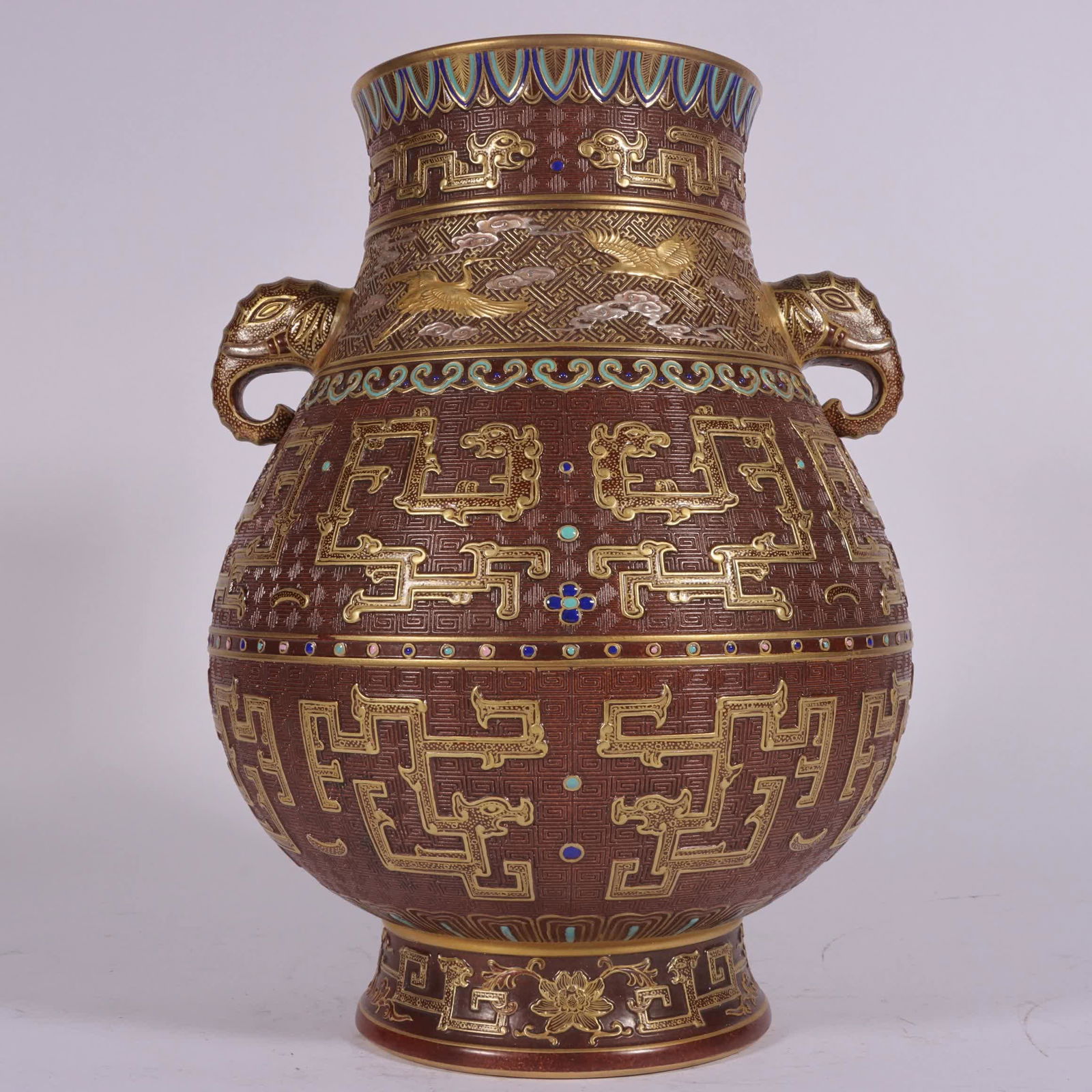 A piece of Qing Qianlong sauce glaze carved Cuojin silver elephant ear statue (1 of 8)