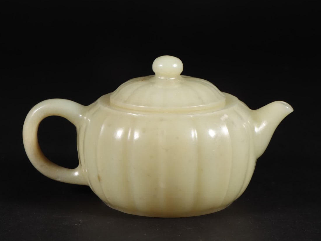 A Qing Dynasty Xinjiang Hetian jade pumpkin pot: Qing Dynasty Xinjiang Hetian jade pumpkin pot SIZE: L:14cm W:9.5cm H:7.6cm W:258g (The Dimensions Of All Batches Are Manually Measured.If You Need More Detailed Information, Please Contact Our Custome