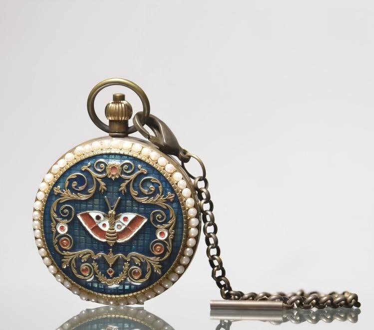 A brass inlaid enamel butterfly pocket watch (1 of 9)