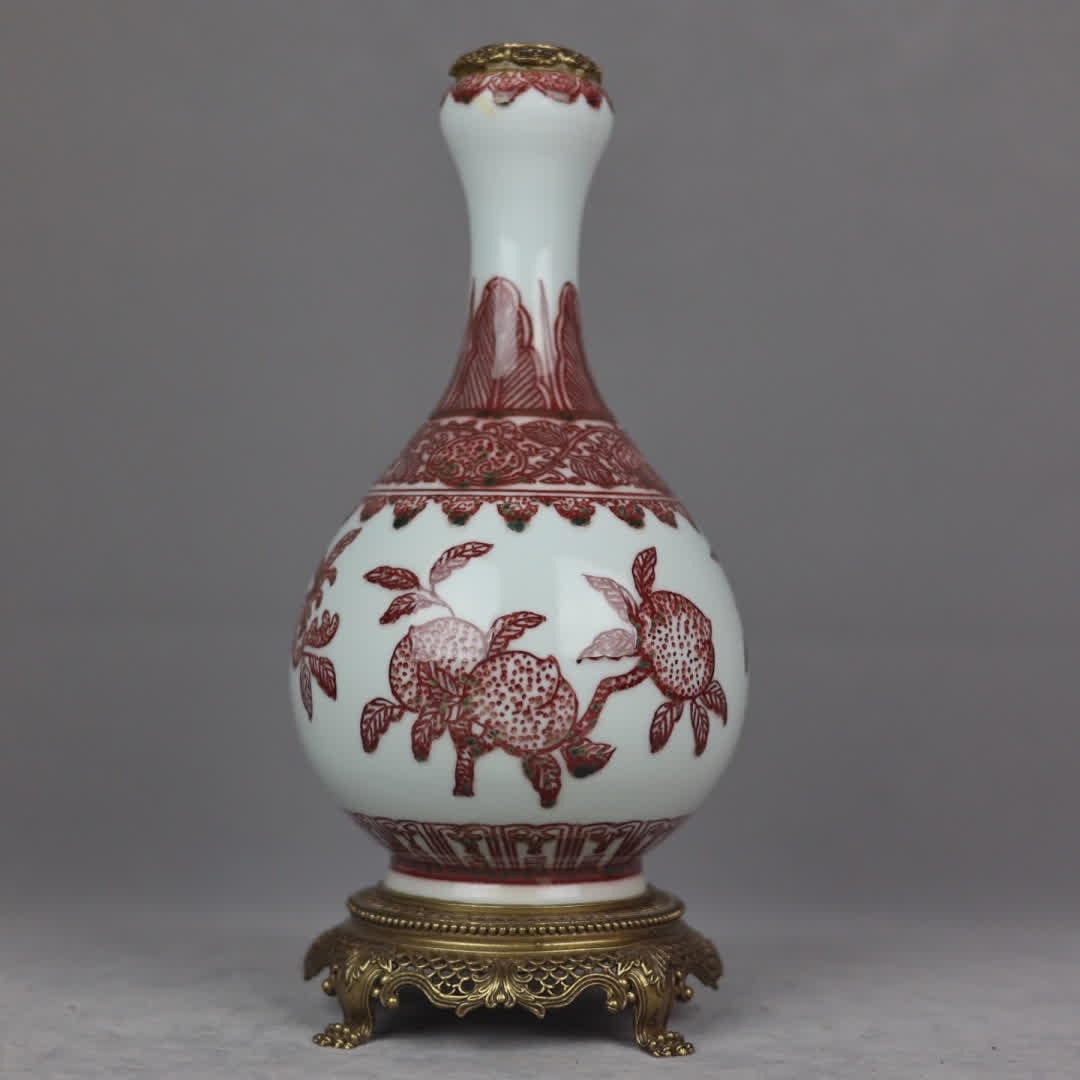 A copper-inlaid porcelain "glazed red three multi-pattern" garlic bottle (1 of 9)