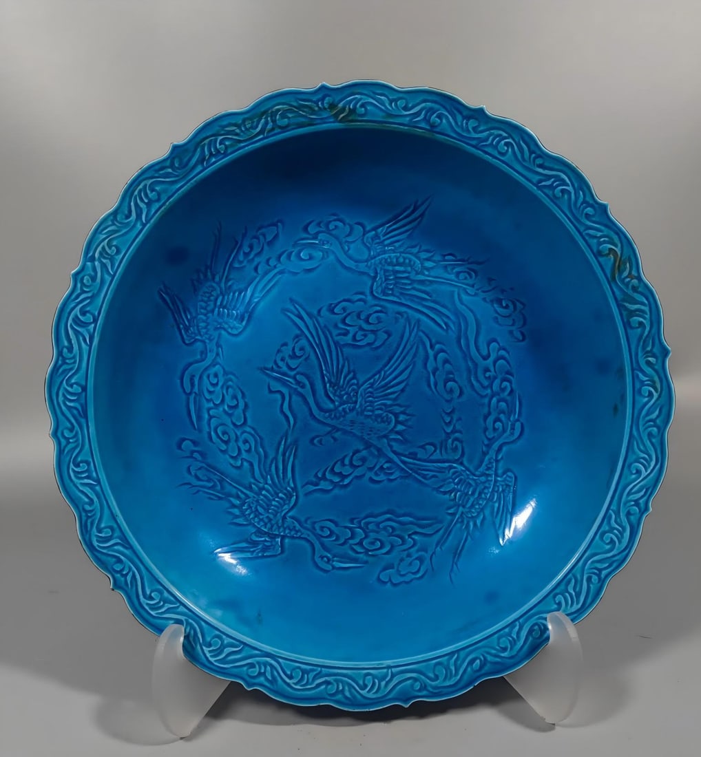 A Qing Dynasty peacock blue carved crane plate (1 of 9)