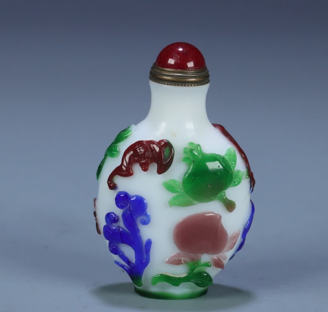 A Qianlong material maker set of three multi-pattern snuff bottles (1 of 10)