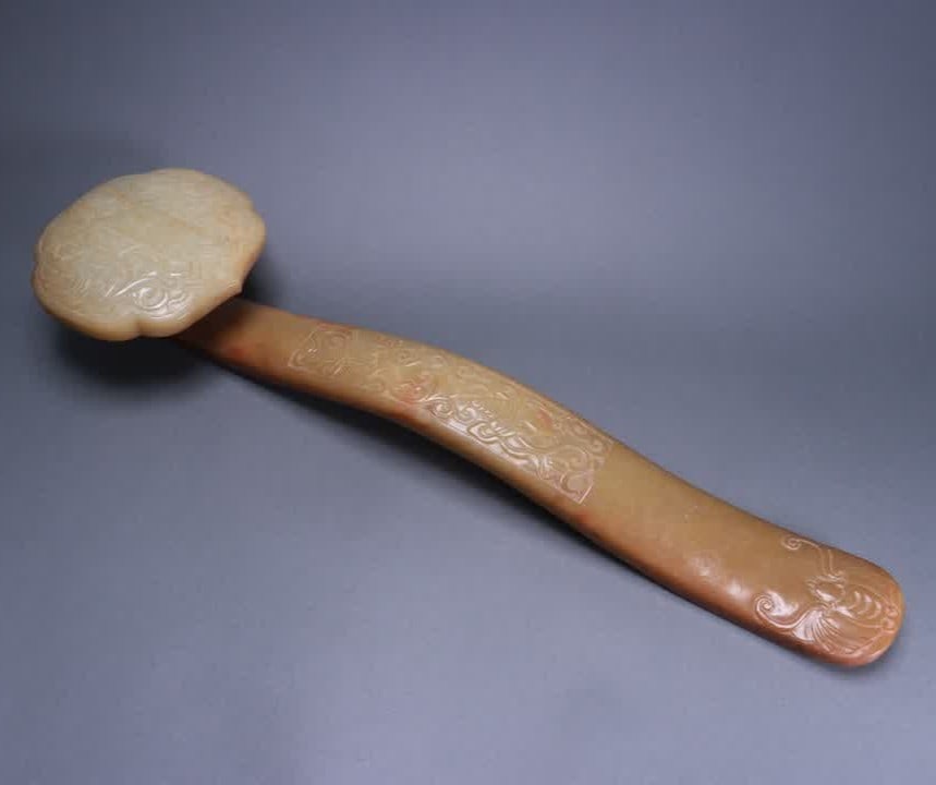 A piece of ancient jade entwined eight treasure pattern jade ruyi (1 of 9)