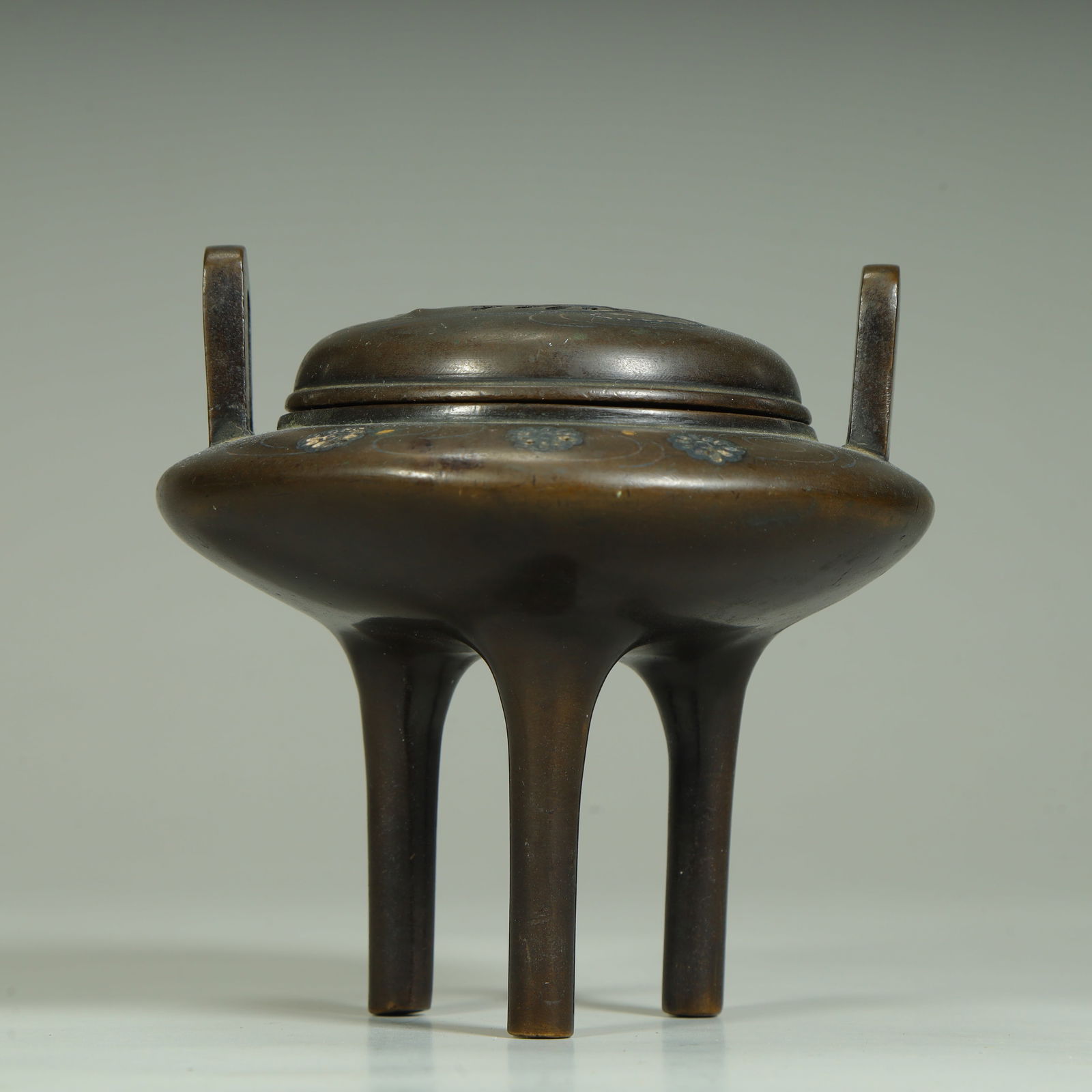 A copper staggered gold and silver floral pattern three-legged smoker (1 of 9)