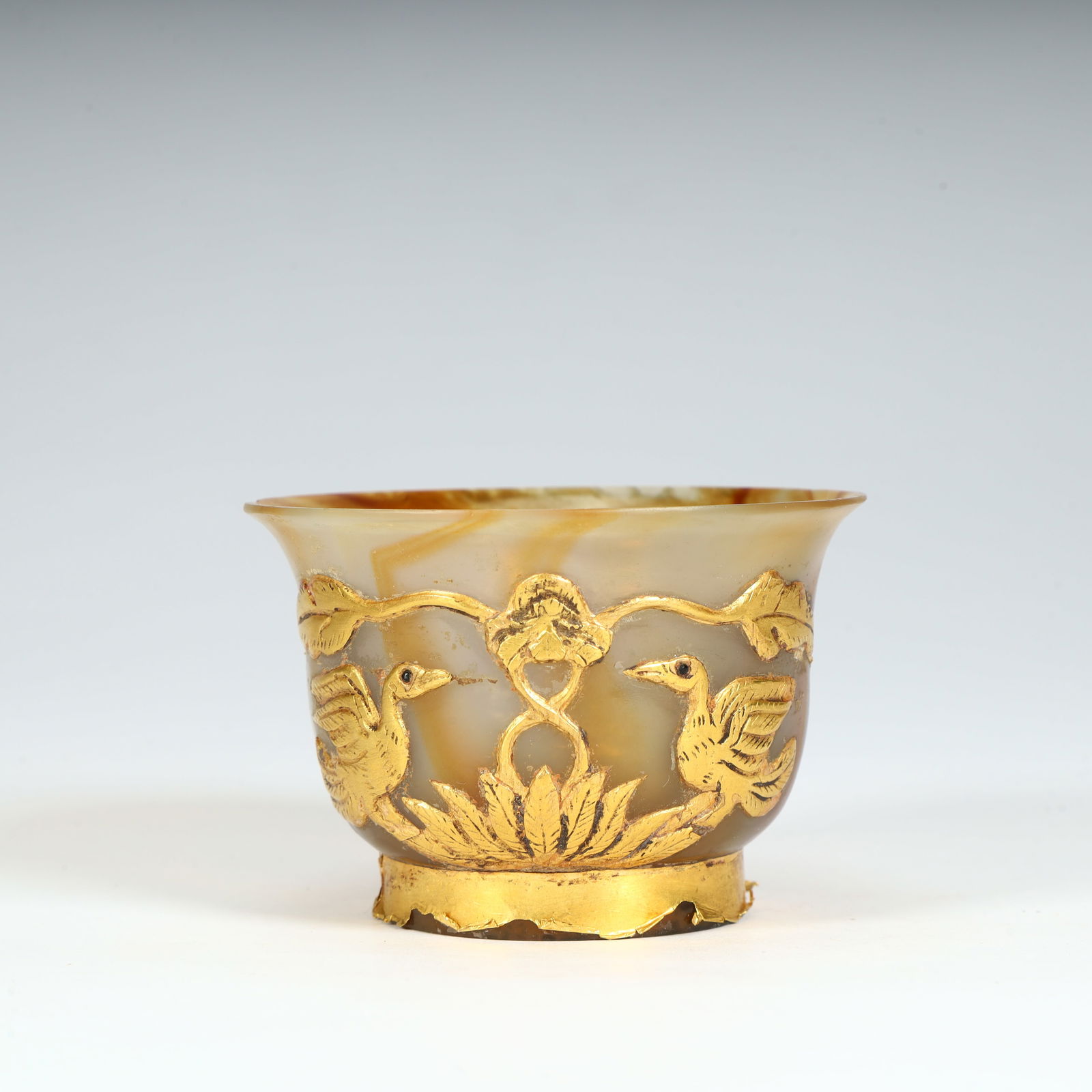 A Tang Dynasty agate-encapsulated gold-clad mandarin duck lotus pattern wine glass (1 of 9)