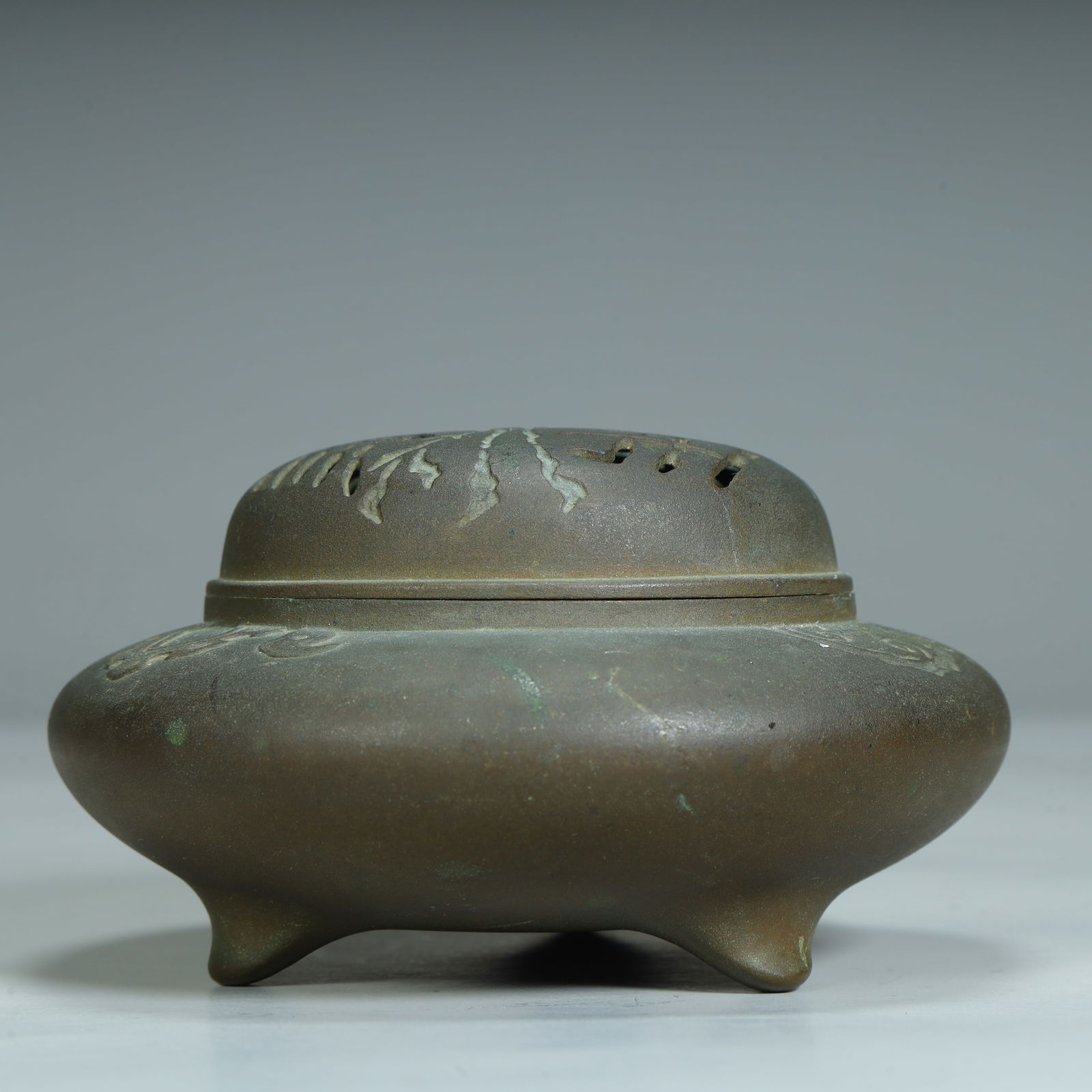 A copper three-legged incense burner (1 of 10)