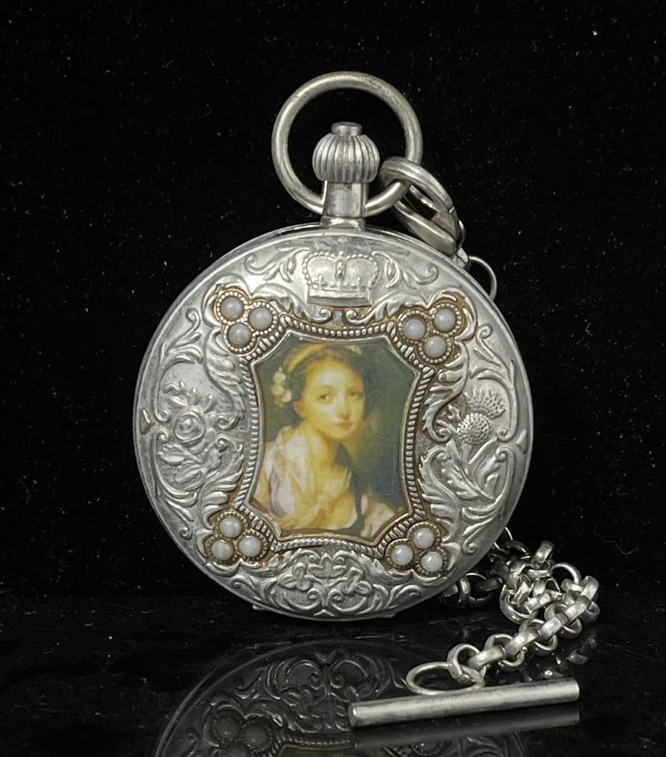 A double-open pocket watch of the sun, moon and stars (1 of 6)