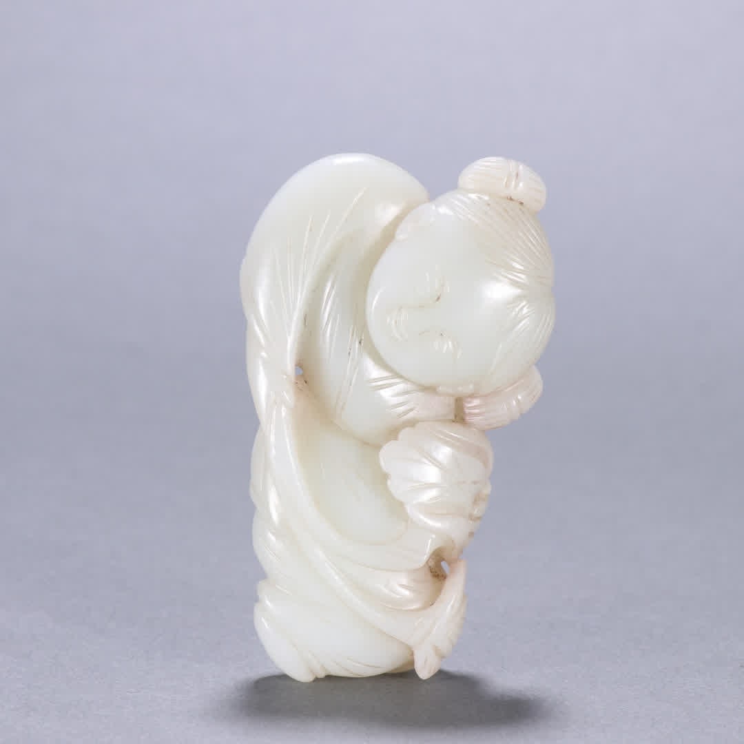 A Qing Dynasty Hetian jade boy carving (1 of 9)