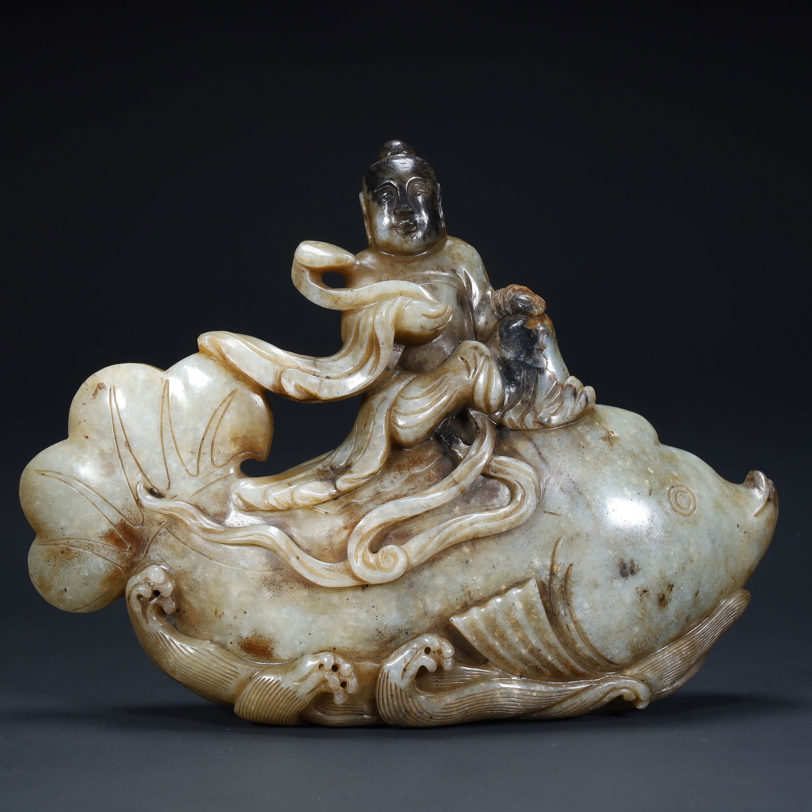 A Qing Dynasty Hetian jade "immortal riding a raft" ornament: Qing Dynasty Hetian jade "immortal chariot" ornament SIZE: H:15cm L:20.5cm W:5cm W:1381g (The Dimensions Of All Batches Are Manually Measured.If You Need More Detailed Information, Please Contact Our