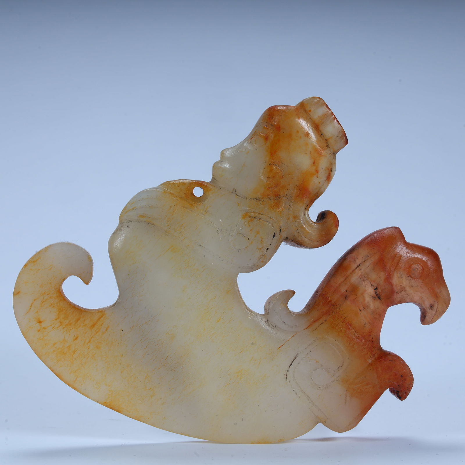 A Han Dynasty Hetian jade immortal riding beast pendant: Han Dynasty Hetian jade immortal riding beast pendant SIZE: H:8.5cm L:10cm W:1.5cm W:129.6g (The Dimensions Of All Batches Are Manually Measured.If You Need More Detailed Information, Please Contact O