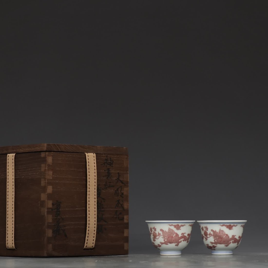 A pair of Ming Chenghua glazed red Kui dragon pattern cups (1 of 9)