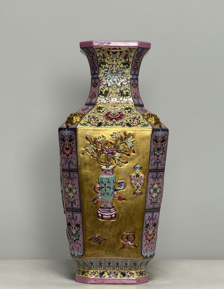 A Qing Qianlong model enamel passionflower gold ground carved Bogu Bafang inlay vase: Qing Qianlong model enamel color passionflower gold ground carving Bogu octagonal inlay bottle SIZE: H:43.8cm W:20cm (The Dimensions Of All Batches Are Manually Measured.If You Need More Detailed Info