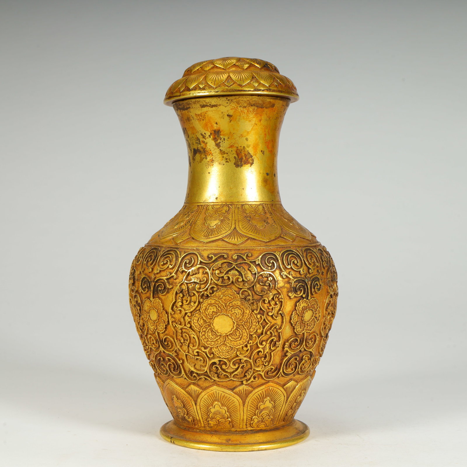 A Qing Dynasty copper gilt entwined lotus pattern lid bottle (1 of 11)