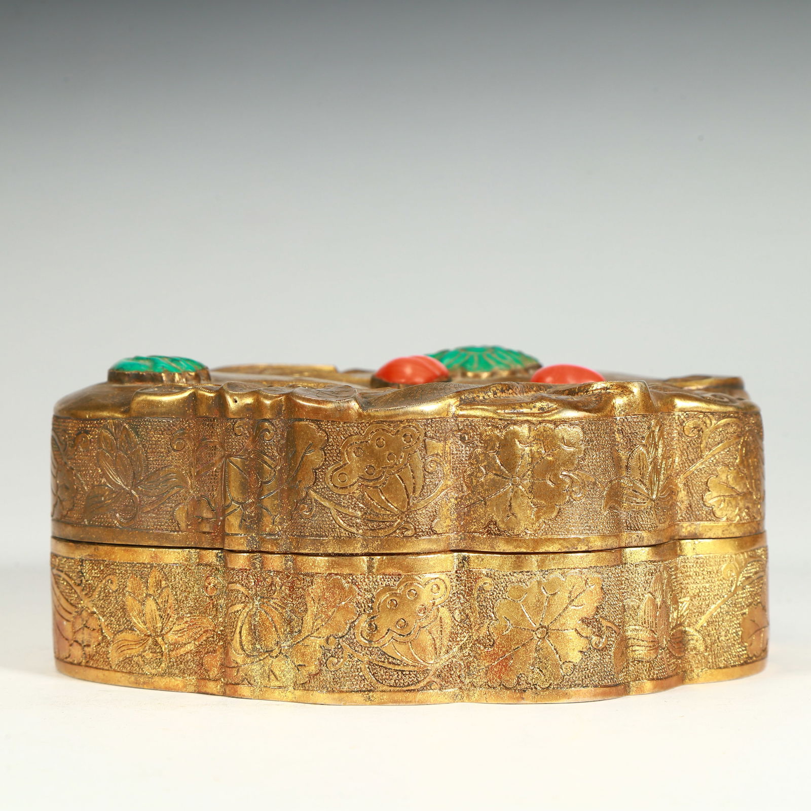 A Qing Dynasty copper gilt inlaid treasure blessing longevity pattern lotus leaf-shaped lid box (1 of 8)