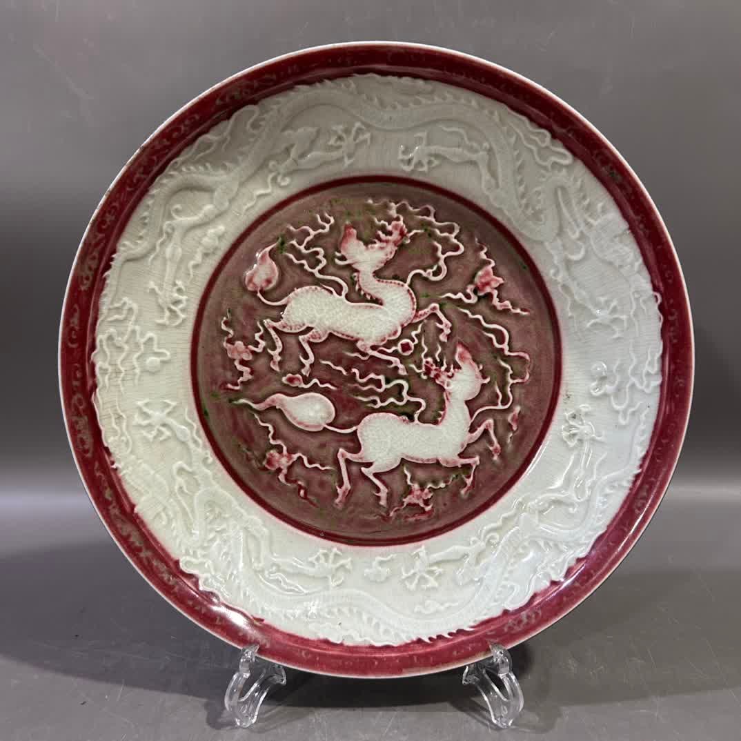 A red sea horse dragon plate with blue outside and inner glaze: Blue on the outside and red sea on the inside glaze SIZE: H:6cm W:32cm (The Dimensions Of All Batches Are Manually Measured.If You Need More Detailed Information, Please Contact Our Customer