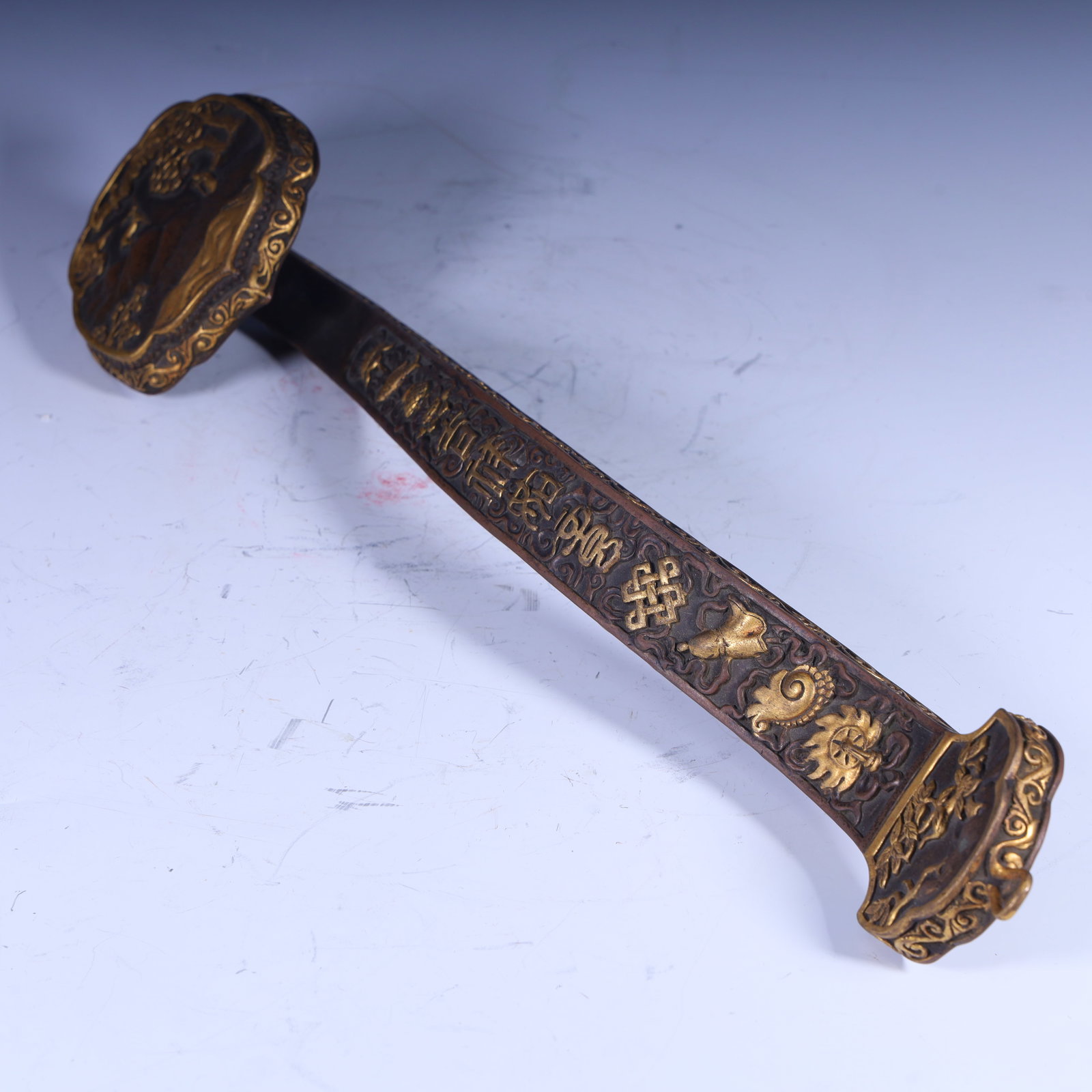 A piece of Qing Dynasty copper gilt carved Buddhist Eight Treasure Ruyi (1 of 9)