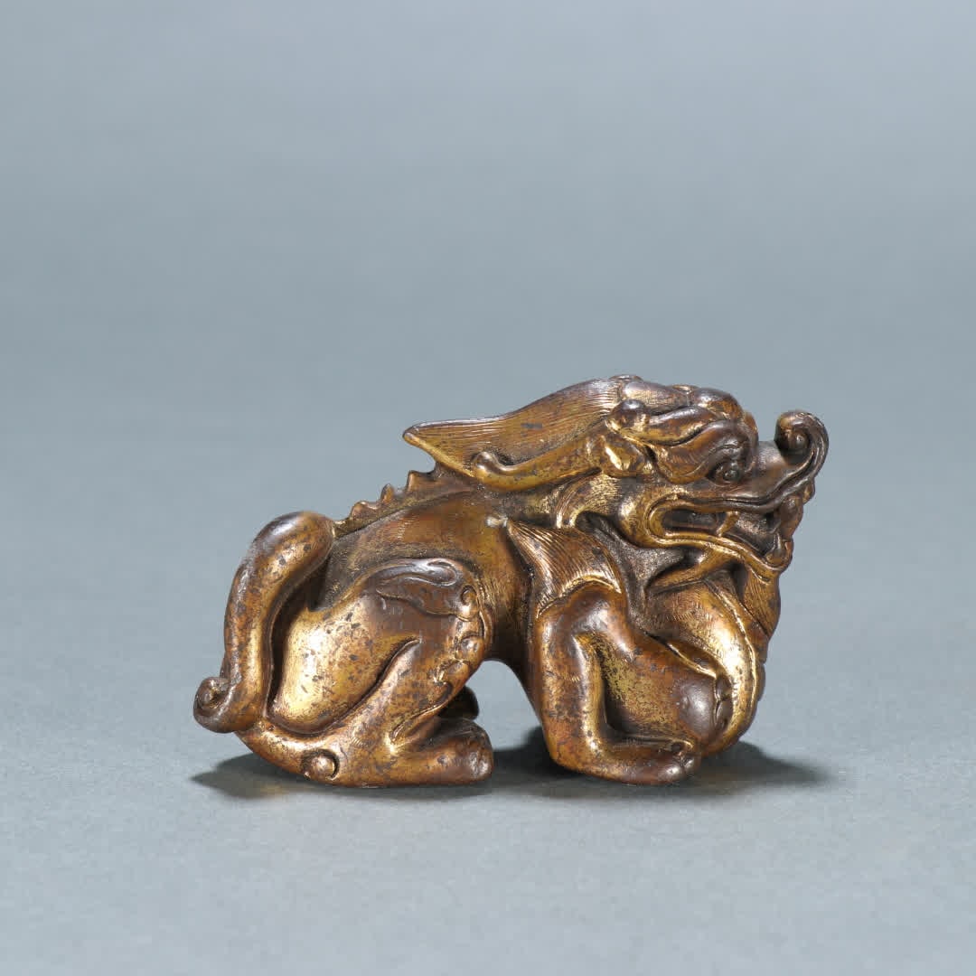 A Qing Dynasty copper gilt beast ornament (1 of 9)