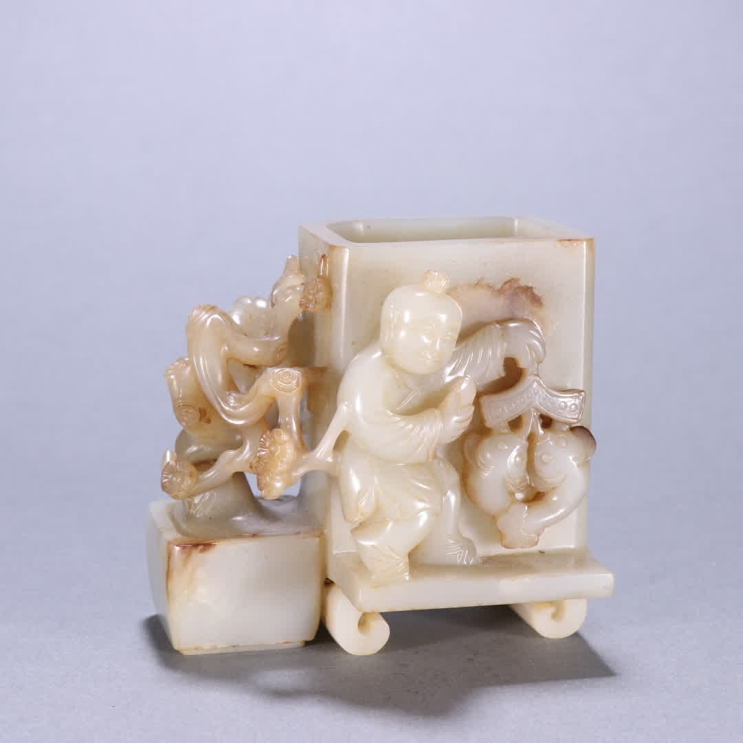 A Qing Dynasty Hetian jade high relief boy pen holder: Qing Dynasty Hetian jade high relief boy pen holder SIZE: H:8.2cm W:8.6cm W:405.7g (The Dimensions Of All Batches Are Manually Measured.If You Need More Detailed Information, Please Contact Our Custom