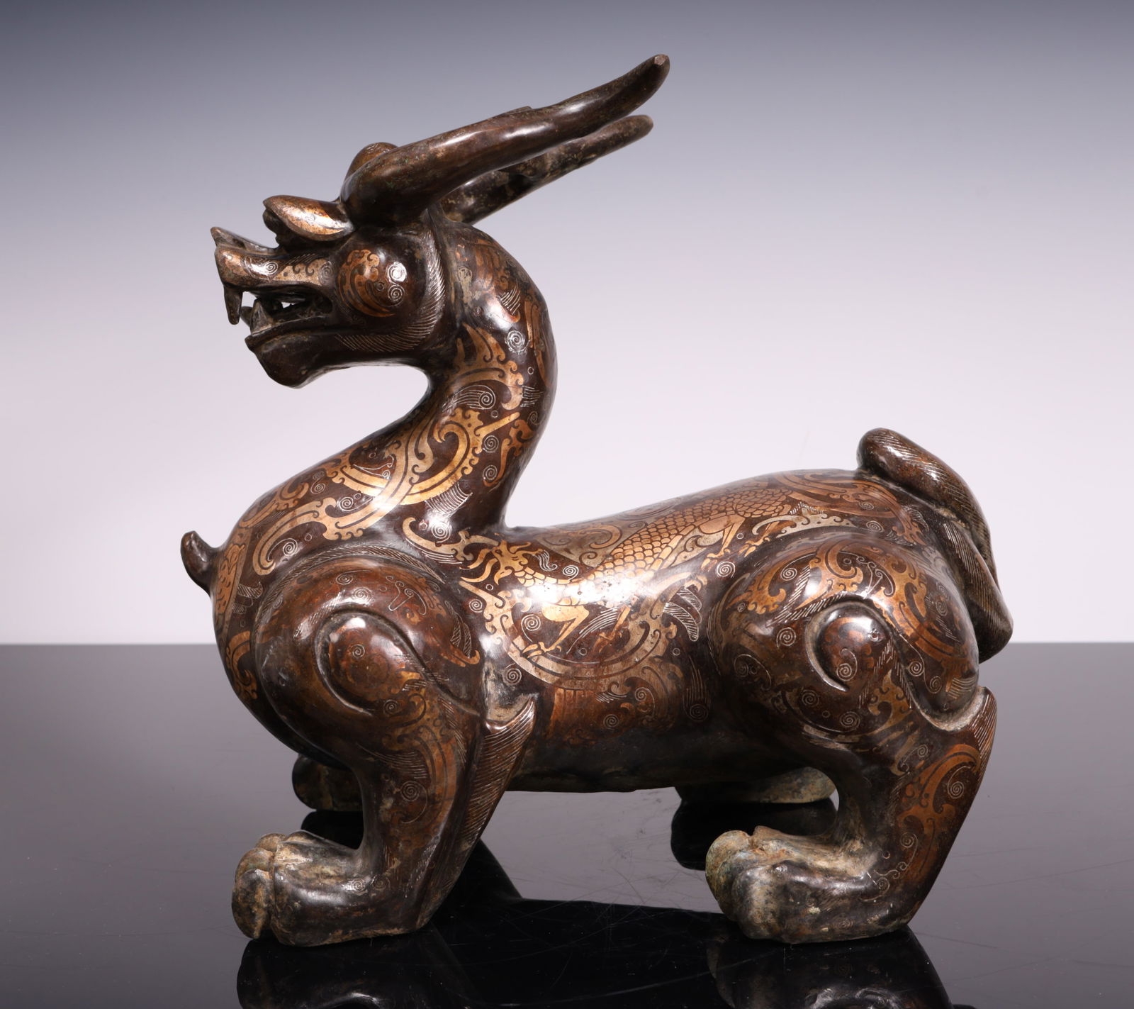 A Han wrong gold and silver divine beast sculpture (1 of 8)