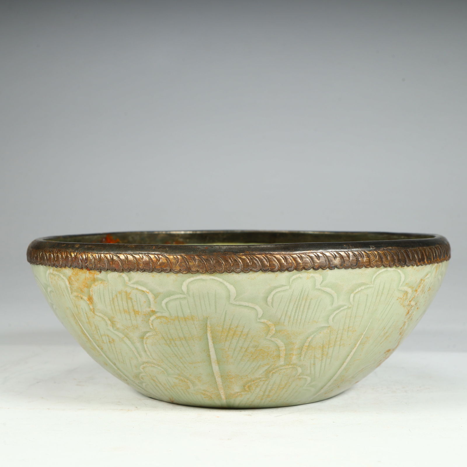 A Ming Dynasty Longquan kiln celadon carved bronze bowl (1 of 9)
