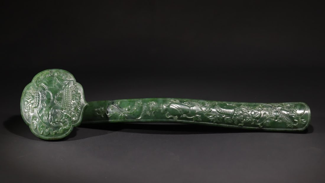 A Qing Dynasty jasper peaceful ornament: Qing Dynasty Taiping Elephant Ruyi Ornament Carved from Hetian jasper, Ruyi adopts relief technique, the "Taiping Elephant" pattern of the Ruyi head is clearly layered, the elephant body is plump, the