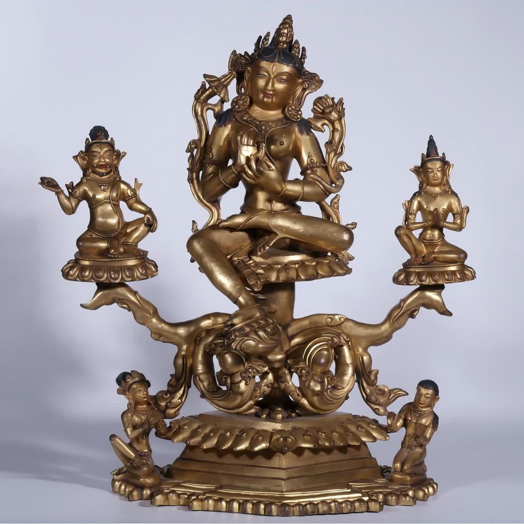 A triple statue of Qing Dynasty Kashmiri style copper-gilt green Tara and its donor (1 of 13)