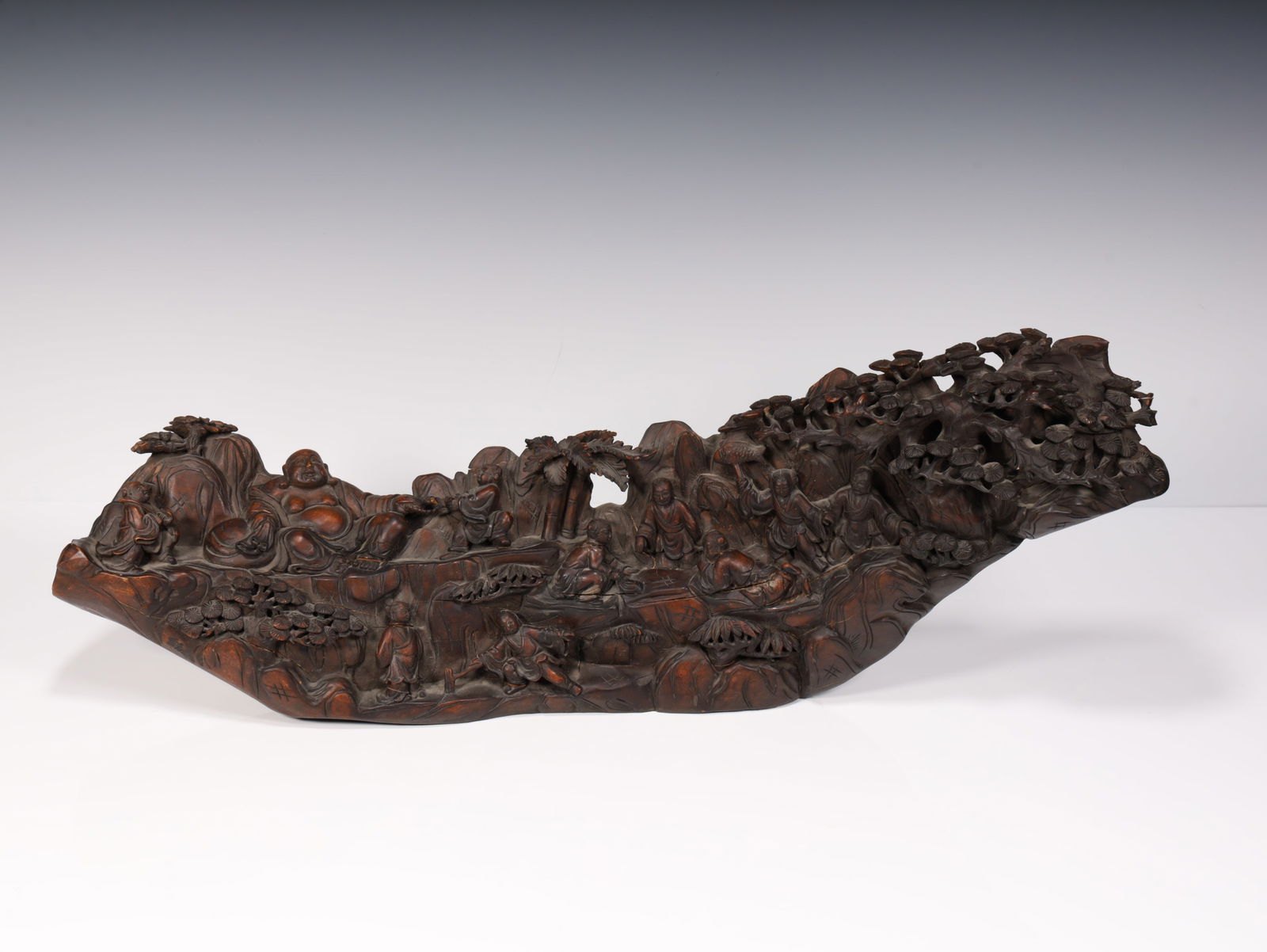 A boxwood carving boy plays Maitreya (1 of 10)