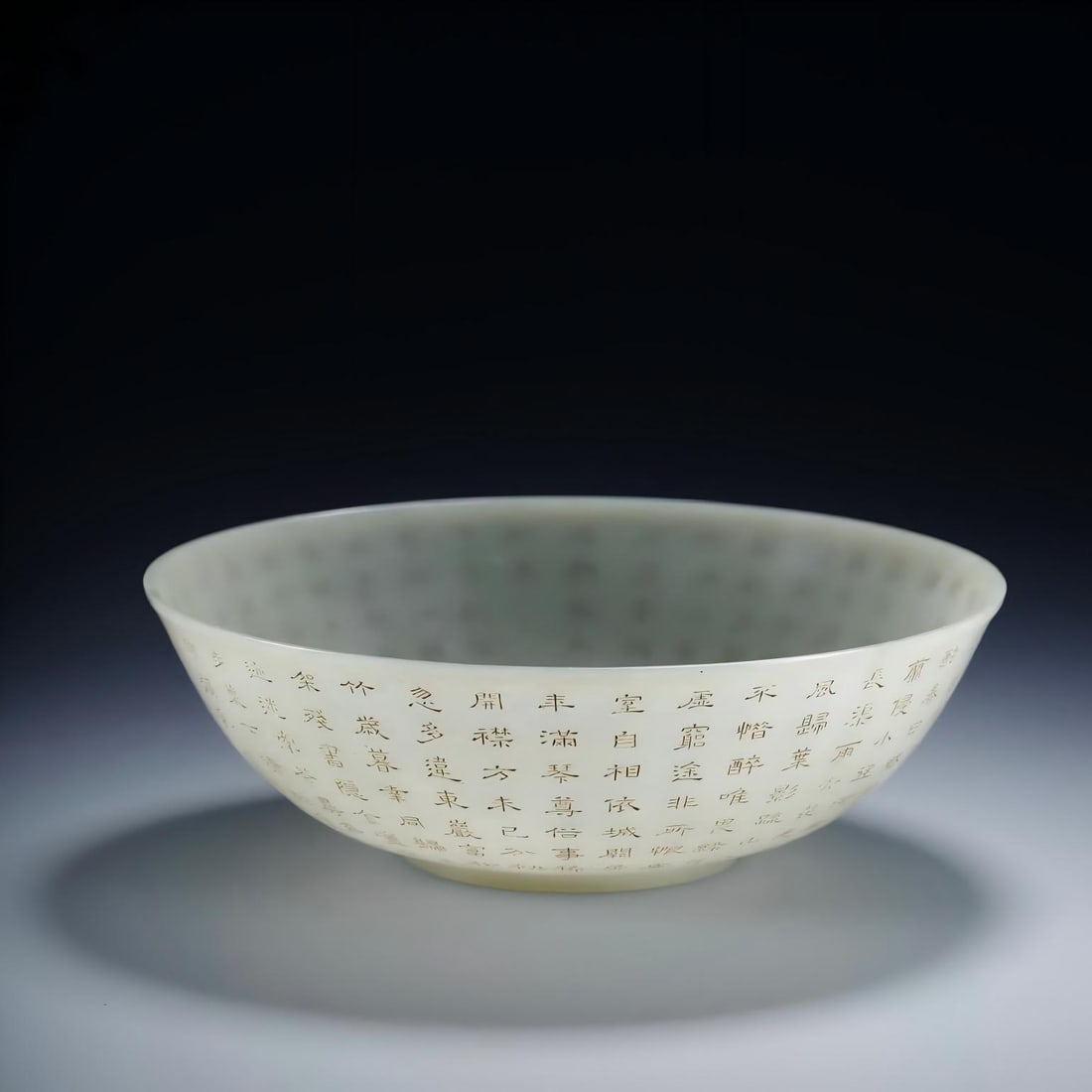 A Qing Dynasty Hetian jade yin carved Qianlong imperial poetry bowl: Qing Dynasty Hetian Yuyin carved Qianlong imperial poetry bowl SIZE: mouthD:17.5cm H:5.8cm W:226.2g