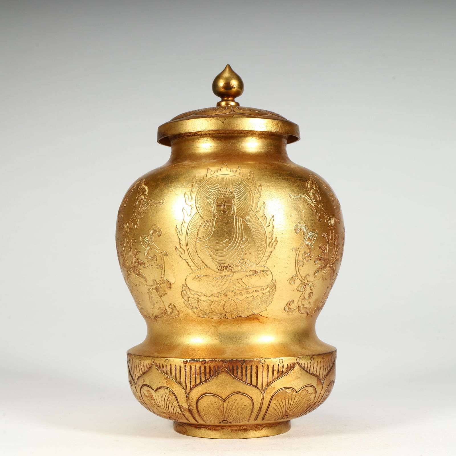A Qing Dynasty copper gilt Buddha pattern relic jar (1 of 9)