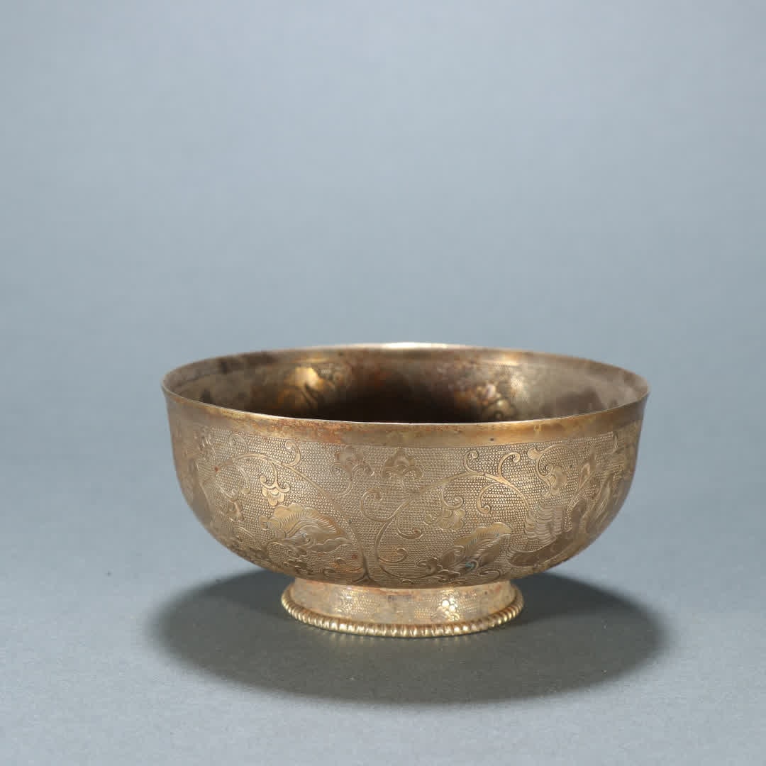 A Qing Dynasty silver-gilt flower and bird pattern bowl (1 of 9)