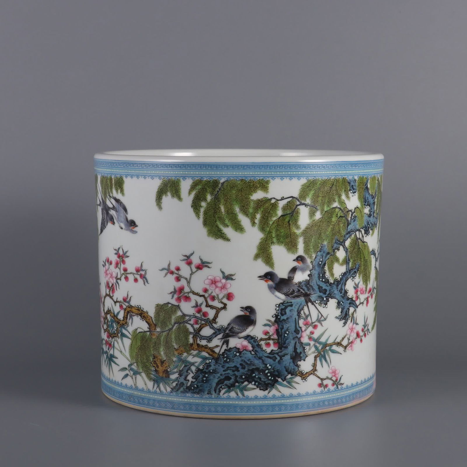 A Qing Yongzheng era enamel colorful apricot forest spring swallow pen holder: Qing Yongzheng year enamel colorful apricot forest spring swallow pen holder SIZE: H:16cm mouthD:19.5cm