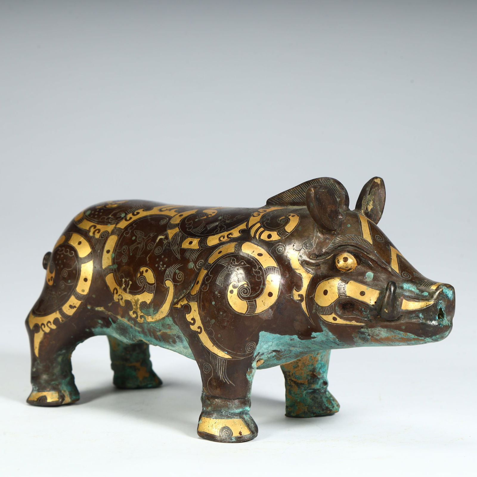 A wrong gold, silver, bronze pig-shaped vessel (1 of 10)
