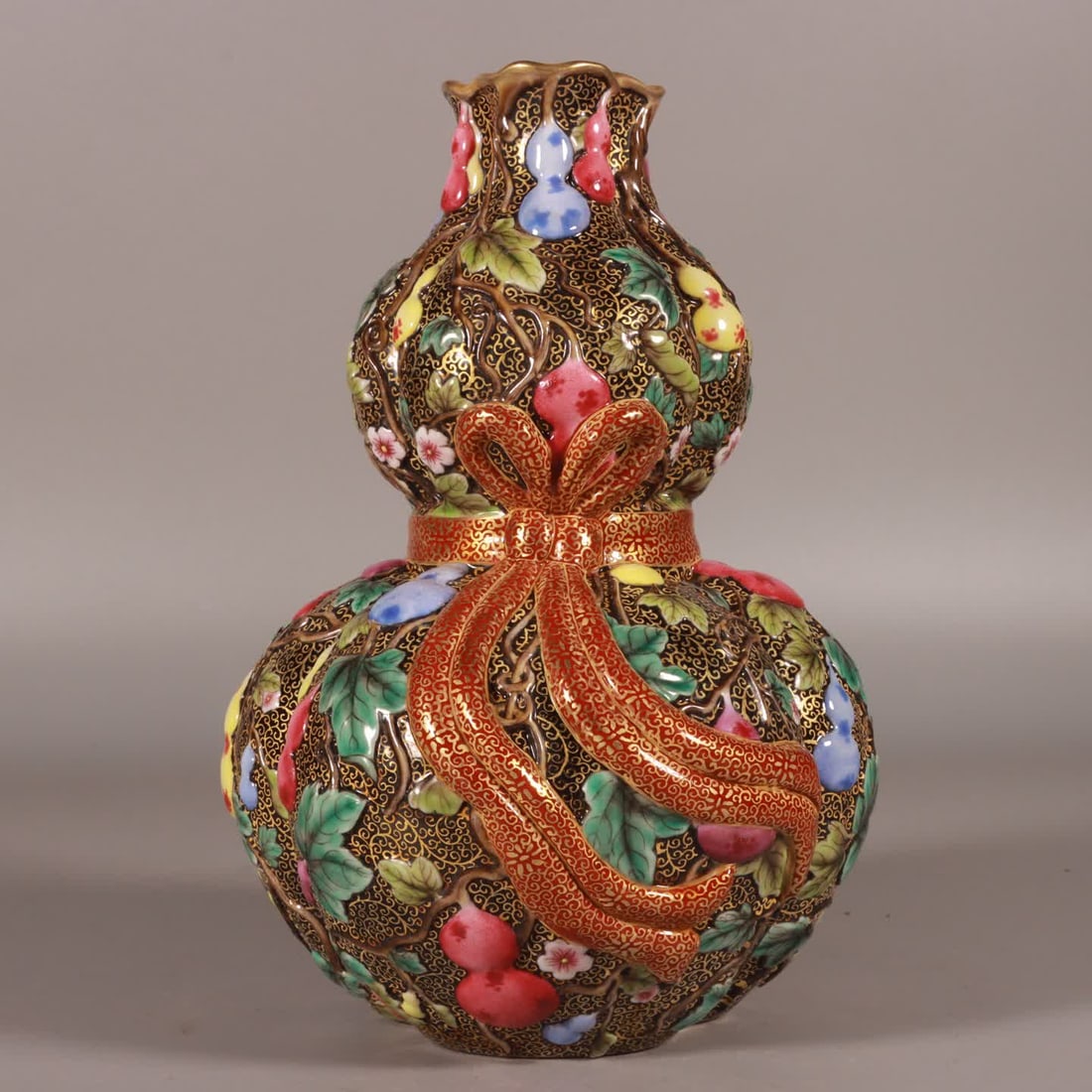 A Qing Qianlong enamel carved melon and lu continuous bagged gourd bottle (1 of 8)