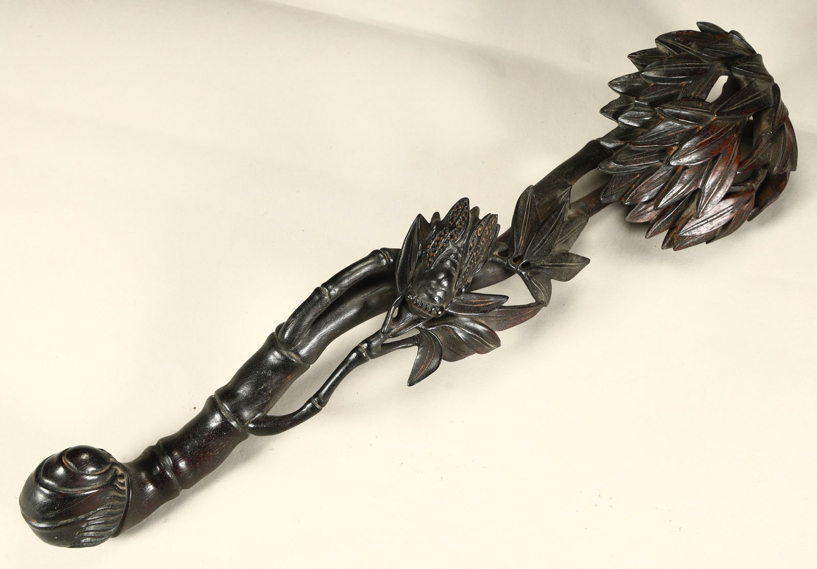 A Qing Dynasty rosewood carved bamboo cicada pattern ruyi: Qing Dynasty rosewood carved bamboo cicada pattern ruyi SIZE: L:32cm W:9cm W:157g