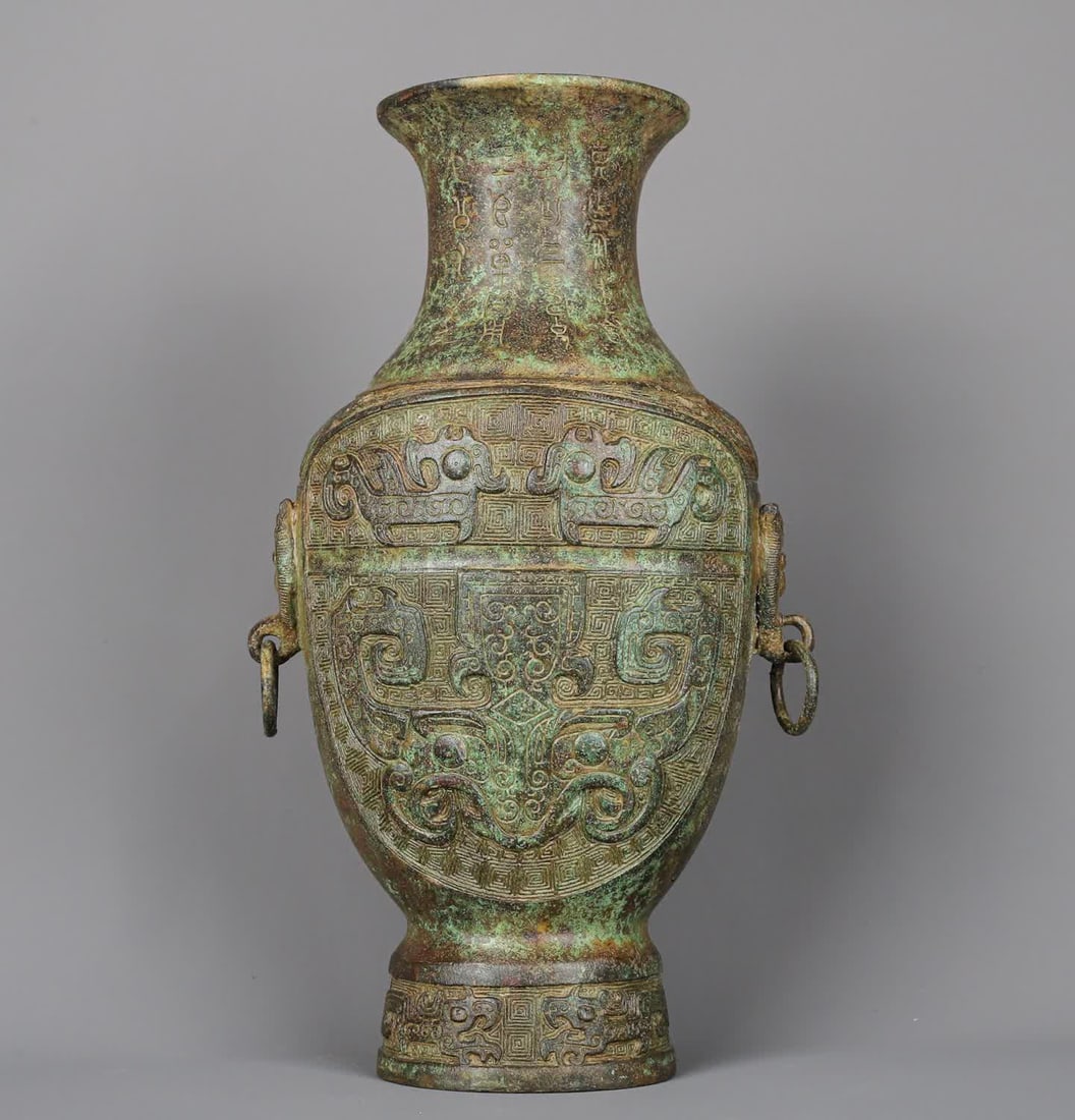 A piece of Western Zhou_ bronze full of animal face flat bottle: Western Zhou_Bronze full of animal face flat bottle SIZE: W:2590g L:21cm W:12cm H:33cm